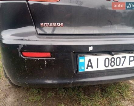 Черный Мицубиси Лансер, объемом двигателя 2 л и пробегом 277 тыс. км за 4650 $, фото 11 на Automoto.ua
