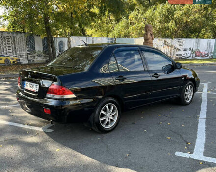 Чорний Міцубісі Lancer, об'ємом двигуна 1.58 л та пробігом 175 тис. км за 5200 $, фото 2 на Automoto.ua