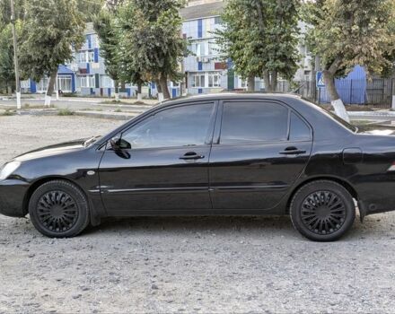 Черный Мицубиси Лансер, объемом двигателя 1.6 л и пробегом 226 тыс. км за 4800 $, фото 5 на Automoto.ua