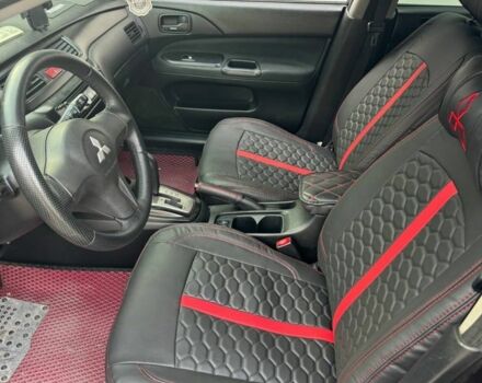 Черный Мицубиси Лансер, объемом двигателя 1.6 л и пробегом 211 тыс. км за 5600 $, фото 6 на Automoto.ua