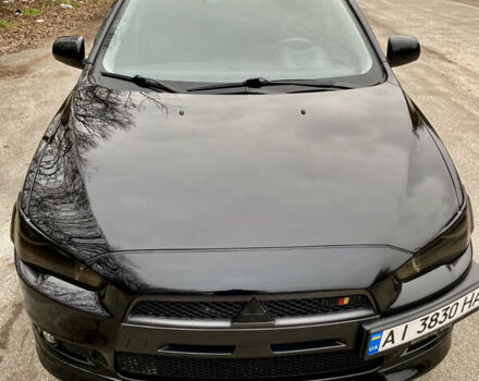 Черный Мицубиси Лансер, объемом двигателя 2 л и пробегом 164 тыс. км за 8300 $, фото 1 на Automoto.ua