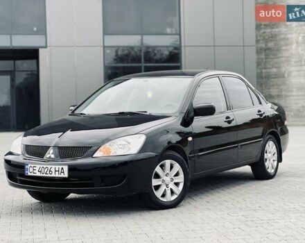 Чорний Міцубісі Lancer, об'ємом двигуна 1.6 л та пробігом 243 тис. км за 4950 $, фото 1 на Automoto.ua