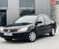 Чорний Міцубісі Lancer, об'ємом двигуна 1.6 л та пробігом 243 тис. км за 4950 $, фото 1 на Automoto.ua