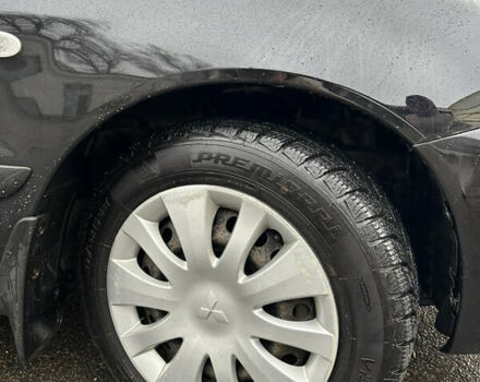 Черный Мицубиси Лансер, объемом двигателя 1.58 л и пробегом 254 тыс. км за 5000 $, фото 7 на Automoto.ua