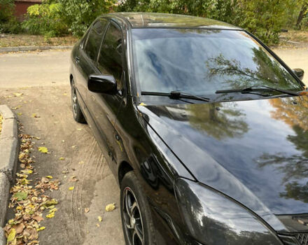 Чорний Міцубісі Lancer, об'ємом двигуна 1.58 л та пробігом 234 тис. км за 3800 $, фото 4 на Automoto.ua