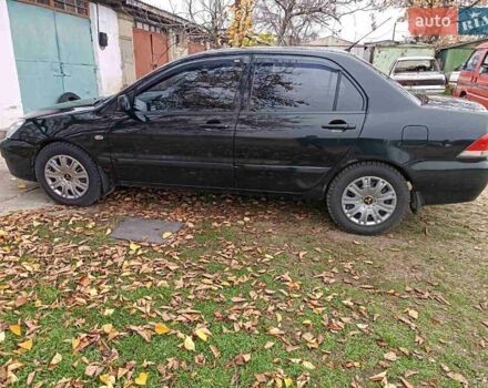 Чорний Міцубісі Lancer, об'ємом двигуна 1.58 л та пробігом 227 тис. км за 4100 $, фото 6 на Automoto.ua