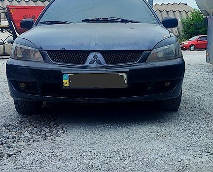 Чорний Міцубісі Lancer, об'ємом двигуна 2 л та пробігом 200 тис. км за 1800 $, фото 4 на Automoto.ua