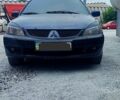 Чорний Міцубісі Lancer, об'ємом двигуна 2 л та пробігом 200 тис. км за 1800 $, фото 4 на Automoto.ua