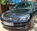 Черный Мицубиси Лансер, объемом двигателя 2 л и пробегом 172 тыс. км за 4750 $, фото 5 на Automoto.ua