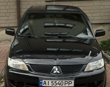 Черный Мицубиси Лансер, объемом двигателя 1.6 л и пробегом 211 тыс. км за 5700 $, фото 44 на Automoto.ua