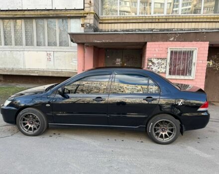 Черный Мицубиси Лансер, объемом двигателя 1.6 л и пробегом 211 тыс. км за 5600 $, фото 4 на Automoto.ua