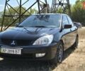 Черный Мицубиси Лансер, объемом двигателя 1.58 л и пробегом 219 тыс. км за 5800 $, фото 1 на Automoto.ua