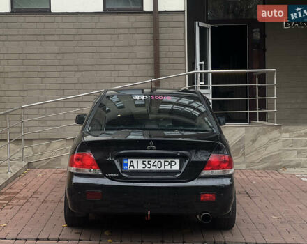 Черный Мицубиси Лансер, объемом двигателя 1.6 л и пробегом 211 тыс. км за 5700 $, фото 8 на Automoto.ua