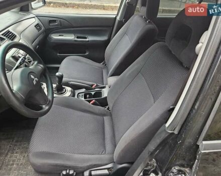 Черный Мицубиси Лансер, объемом двигателя 1.6 л и пробегом 152 тыс. км за 4999 $, фото 9 на Automoto.ua