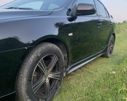 Черный Мицубиси Лансер, объемом двигателя 2 л и пробегом 208 тыс. км за 4300 $, фото 1 на Automoto.ua