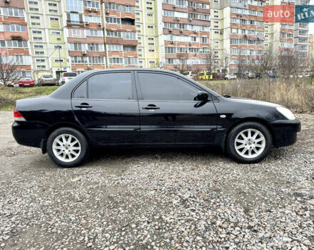 Черный Мицубиси Лансер, объемом двигателя 1.6 л и пробегом 216 тыс. км за 4990 $, фото 5 на Automoto.ua