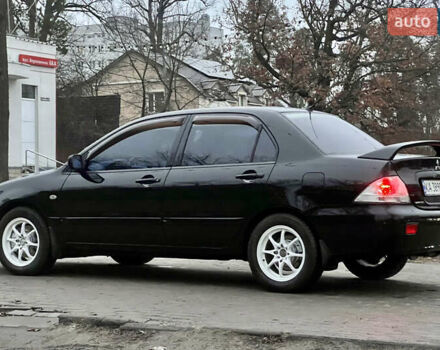 Чорний Міцубісі Lancer, об'ємом двигуна 1.6 л та пробігом 303 тис. км за 4350 $, фото 6 на Automoto.ua
