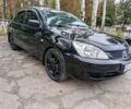 Чорний Міцубісі Lancer, об'ємом двигуна 1.6 л та пробігом 260 тис. км за 4039 $, фото 1 на Automoto.ua