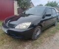 Чорний Міцубісі Lancer, об'ємом двигуна 1.6 л та пробігом 261 тис. км за 2507 $, фото 1 на Automoto.ua