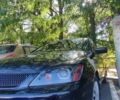 Чорний Міцубісі Lancer, об'ємом двигуна 1.6 л та пробігом 221 тис. км за 4600 $, фото 13 на Automoto.ua