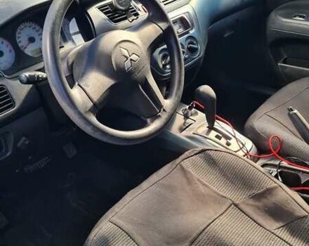 Черный Мицубиси Лансер, объемом двигателя 1.6 л и пробегом 185 тыс. км за 3300 $, фото 5 на Automoto.ua