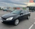 Чорний Міцубісі Lancer, об'ємом двигуна 1.58 л та пробігом 300 тис. км за 2900 $, фото 1 на Automoto.ua
