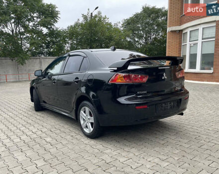 Черный Мицубиси Лансер, объемом двигателя 2 л и пробегом 200 тыс. км за 6199 $, фото 3 на Automoto.ua
