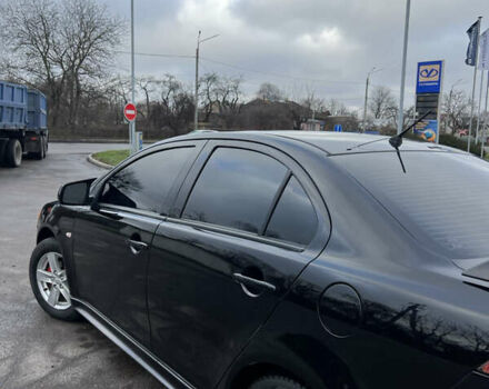 Черный Мицубиси Лансер, объемом двигателя 2 л и пробегом 350 тыс. км за 6700 $, фото 5 на Automoto.ua