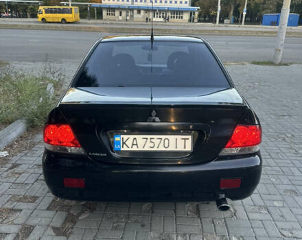 Черный Мицубиси Лансер, объемом двигателя 1.59 л и пробегом 269 тыс. км за 4999 $, фото 8 на Automoto.ua