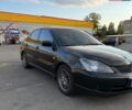 Черный Мицубиси Лансер, объемом двигателя 2 л и пробегом 290 тыс. км за 4000 $, фото 1 на Automoto.ua