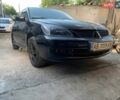 Черный Мицубиси Лансер, объемом двигателя 1.58 л и пробегом 250 тыс. км за 4200 $, фото 1 на Automoto.ua