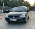 Черный Мицубиси Лансер, объемом двигателя 1.6 л и пробегом 240 тыс. км за 3999 $, фото 1 на Automoto.ua