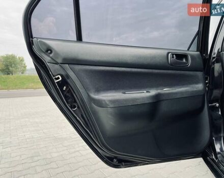 Чорний Міцубісі Lancer, об'ємом двигуна 1.6 л та пробігом 243 тис. км за 4950 $, фото 45 на Automoto.ua
