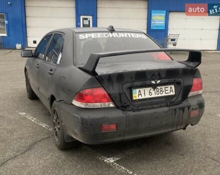 Черный Мицубиси Лансер, объемом двигателя 1.58 л и пробегом 263 тыс. км за 4000 $, фото 35 на Automoto.ua