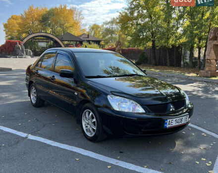 Чорний Міцубісі Lancer, об'ємом двигуна 1.58 л та пробігом 175 тис. км за 5200 $, фото 1 на Automoto.ua
