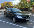 Чорний Міцубісі Lancer, об'ємом двигуна 1.58 л та пробігом 175 тис. км за 5200 $, фото 1 на Automoto.ua