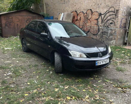 Черный Мицубиси Лансер, объемом двигателя 1.6 л и пробегом 258 тыс. км за 2999 $, фото 1 на Automoto.ua