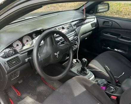 Черный Мицубиси Лансер, объемом двигателя 1.6 л и пробегом 244 тыс. км за 4100 $, фото 6 на Automoto.ua