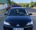 Черный Мицубиси Лансер, объемом двигателя 1.6 л и пробегом 266 тыс. км за 4100 $, фото 1 на Automoto.ua