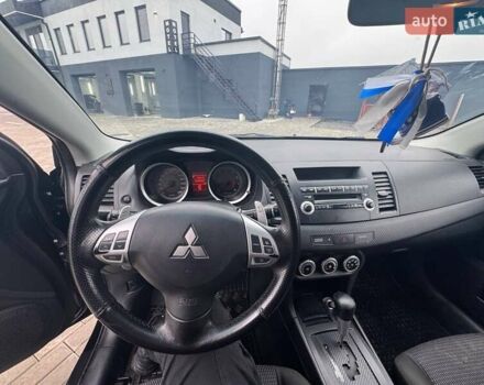 Черный Мицубиси Лансер, объемом двигателя 2 л и пробегом 259 тыс. км за 6500 $, фото 7 на Automoto.ua
