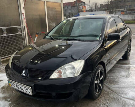 Черный Мицубиси Лансер, объемом двигателя 1.6 л и пробегом 180 тыс. км за 3499 $, фото 3 на Automoto.ua