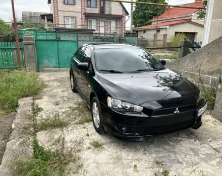 Черный Мицубиси Лансер, объемом двигателя 2 л и пробегом 200 тыс. км за 6900 $, фото 1 на Automoto.ua