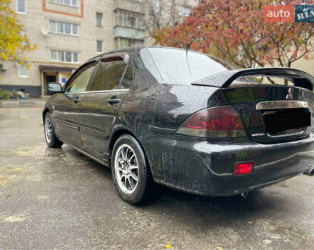 Черный Мицубиси Лансер, объемом двигателя 1.58 л и пробегом 265 тыс. км за 3550 $, фото 10 на Automoto.ua