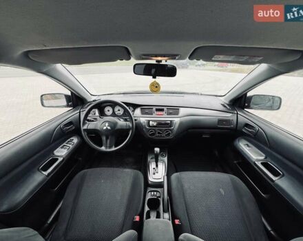Чорний Міцубісі Lancer, об'ємом двигуна 1.6 л та пробігом 243 тис. км за 4950 $, фото 48 на Automoto.ua
