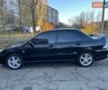 Черный Мицубиси Лансер, объемом двигателя 2 л и пробегом 280 тыс. км за 5400 $, фото 1 на Automoto.ua
