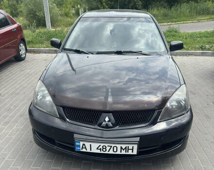 Чорний Міцубісі Lancer, об'ємом двигуна 2 л та пробігом 210 тис. км за 5500 $, фото 37 на Automoto.ua