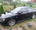 Чорний Міцубісі Lancer, об'ємом двигуна 2 л та пробігом 230 тис. км за 5200 $, фото 1 на Automoto.ua