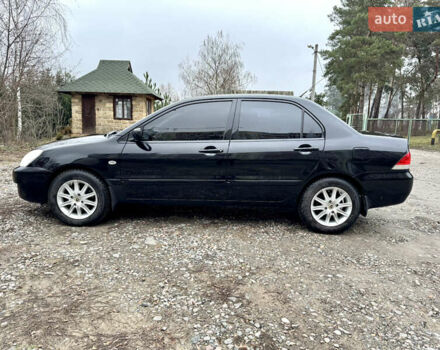 Черный Мицубиси Лансер, объемом двигателя 1.6 л и пробегом 216 тыс. км за 4990 $, фото 1 на Automoto.ua