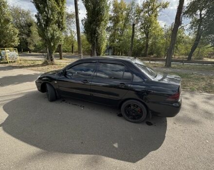 Черный Мицубиси Лансер, объемом двигателя 1.6 л и пробегом 244 тыс. км за 4500 $, фото 2 на Automoto.ua