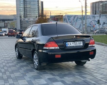 Черный Мицубиси Лансер, объемом двигателя 1.6 л и пробегом 237 тыс. км за 4300 $, фото 4 на Automoto.ua